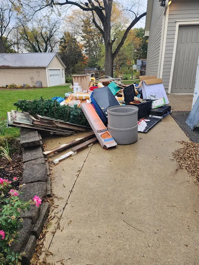 Dumpster being loaded with debris for Residential Dumpster Rental in Cedarburg